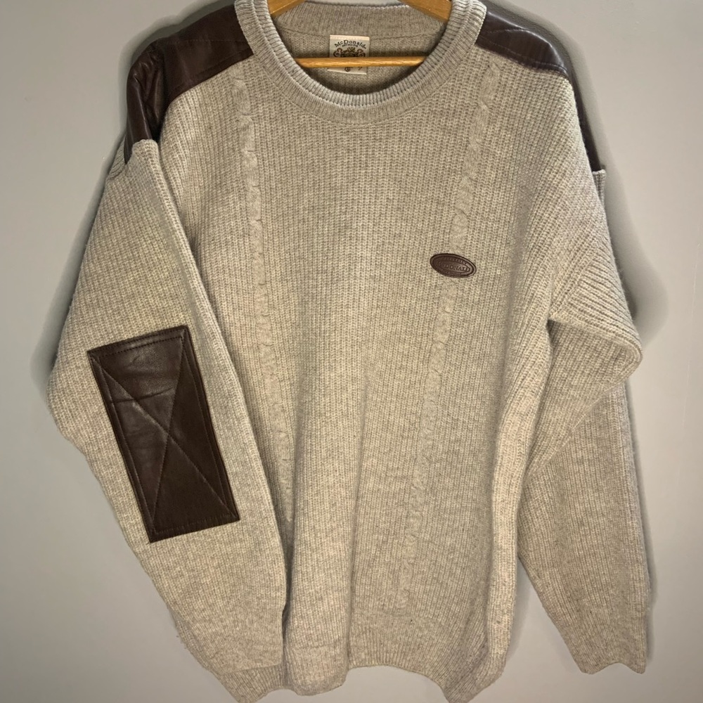 100% men’s Lg wool sweater. Taupe with brown shoulder and elbow pads.